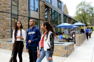 Three Cheyney students standing together on campusPicture