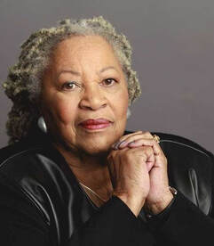 A portrait of Toni Morrison wearing a leather-breasted blazer with cloth sleeves